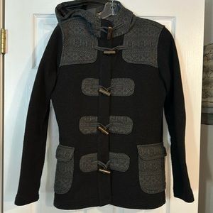 Patagonia women’s black and grey coat.